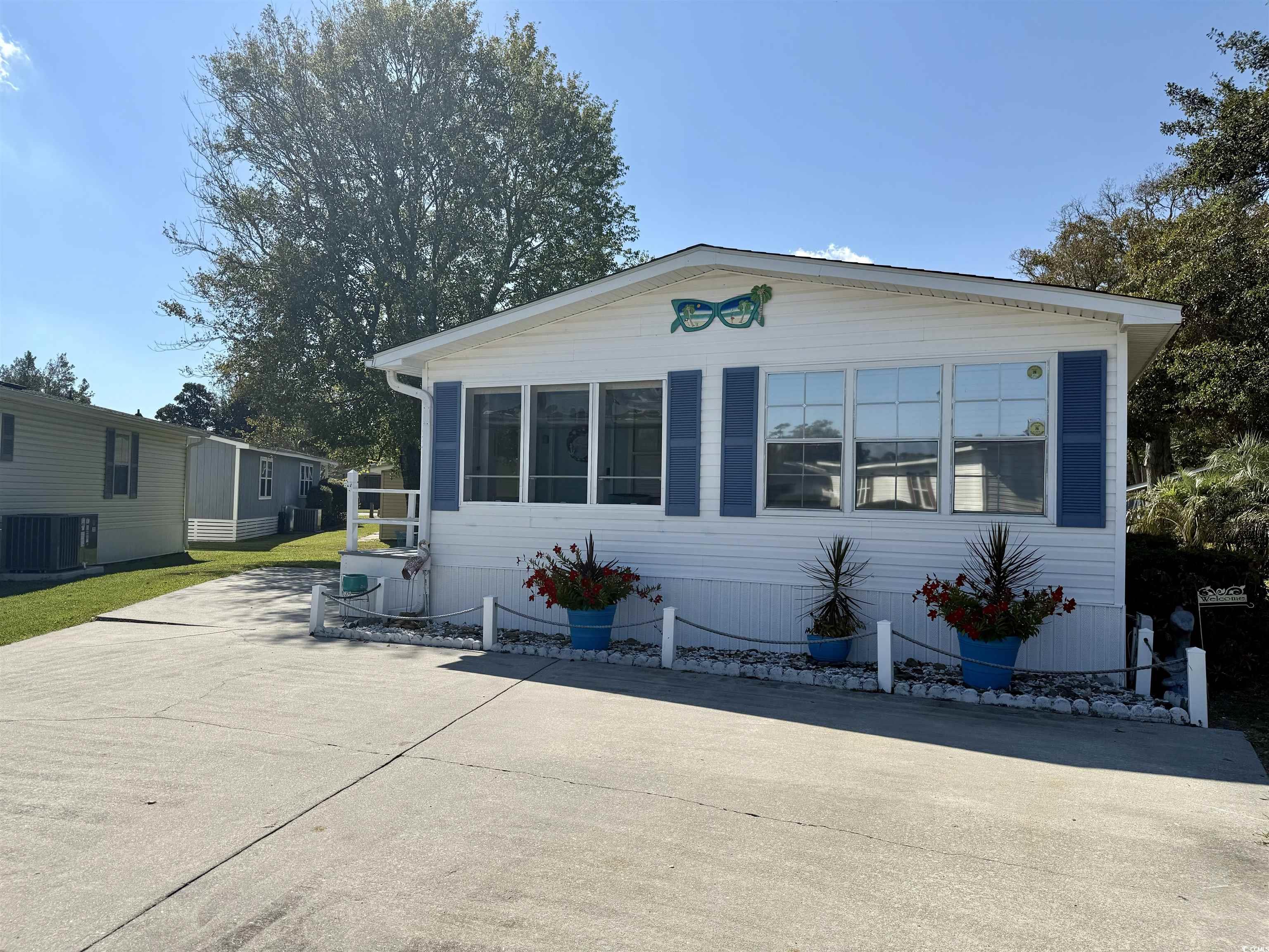 523 Sandpebble Surfside Beach, SC 29575 - Photo 29 of 31 Manufactured / mobile home with central AC unit