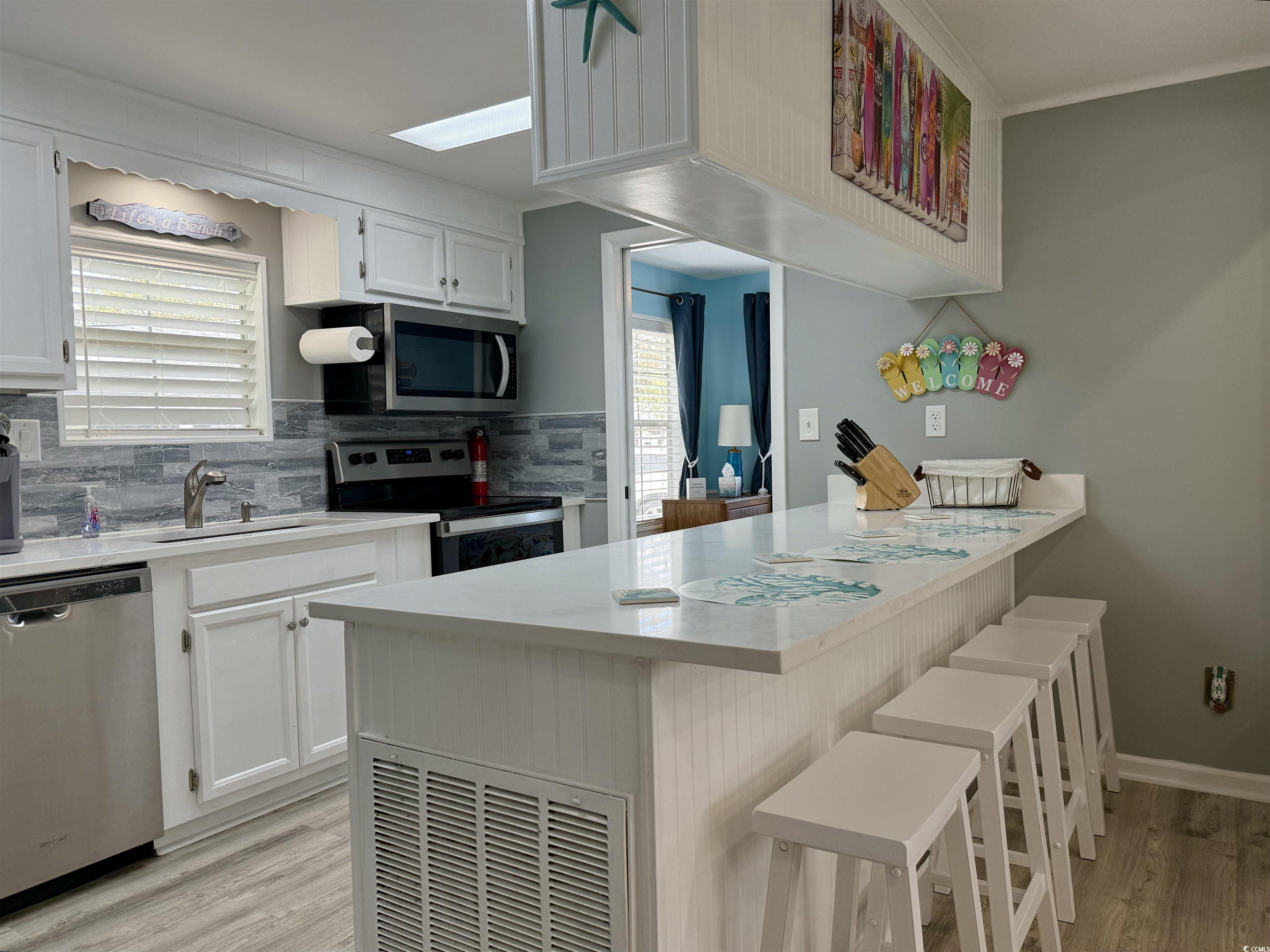 523 Sandpebble Surfside Beach, SC 29575 - Photo 7 of 31 Kitchen with appliances with stainless steel finis