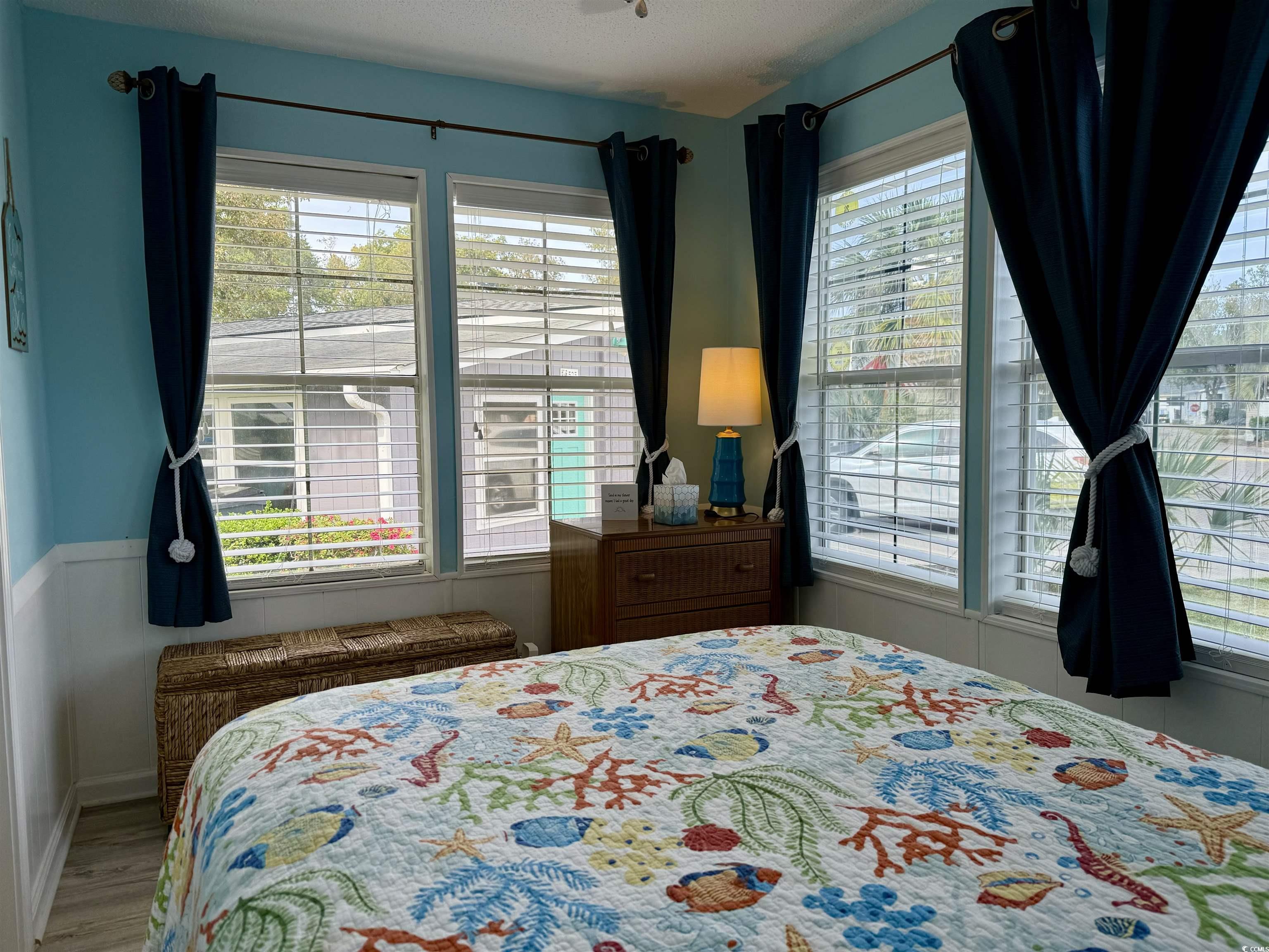 523 Sandpebble Surfside Beach, SC 29575 - Photo 9 of 31 Bedroom featuring wood-type flooring and a texture