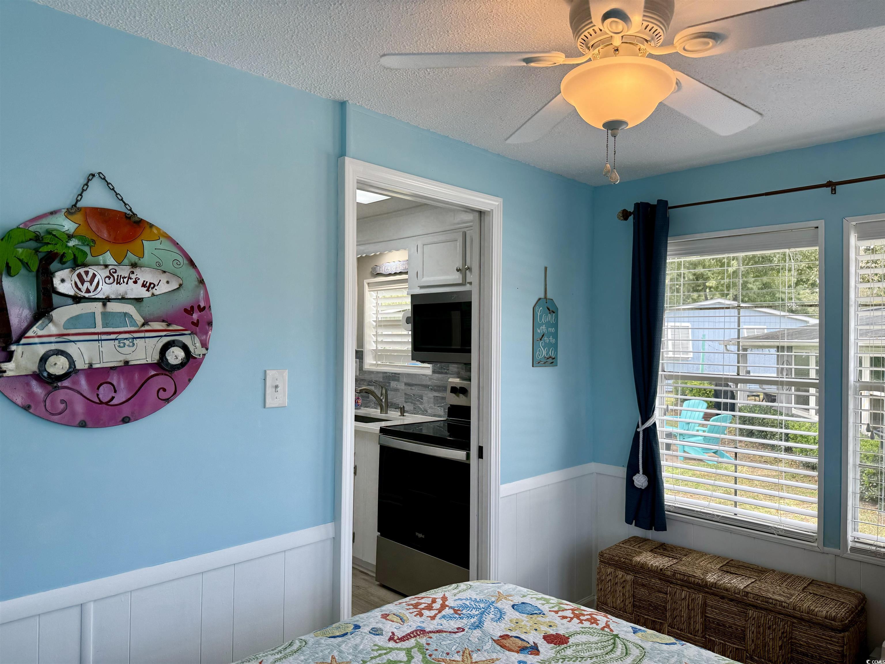 523 Sandpebble Surfside Beach, SC 29575 - Photo 10 of 31 Bedroom featuring wood-type flooring, a textured c