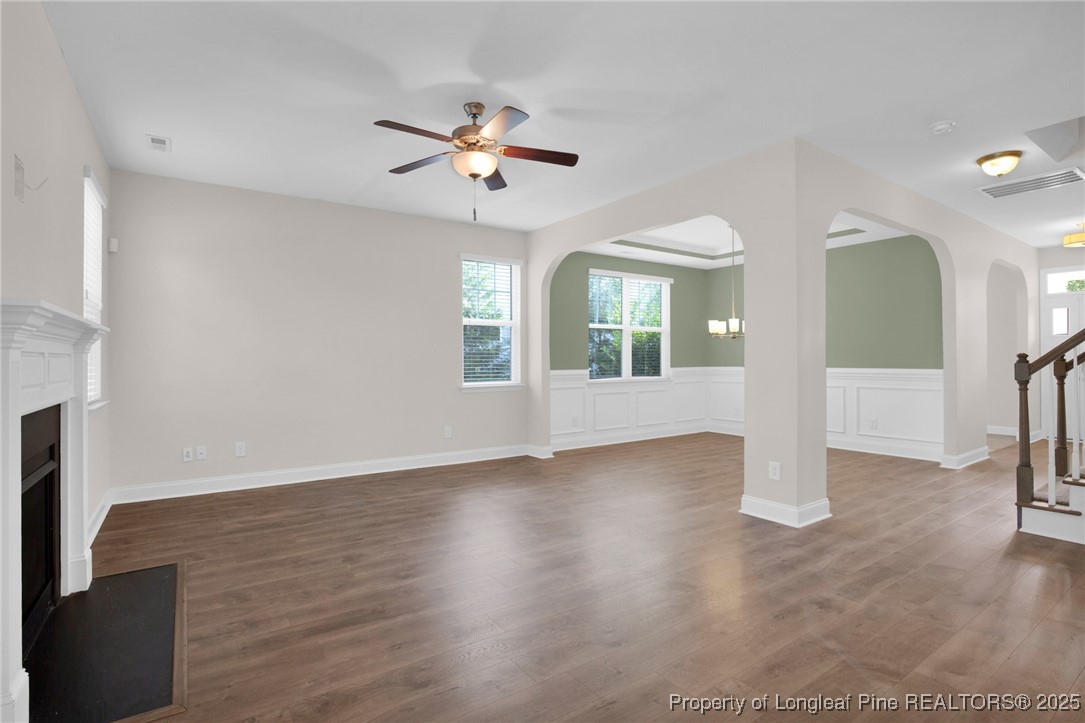 136 Loch Lane Cameron, NC 28326 - Photo 12 of 49 a view of an empty room with chandelier fan and fire place