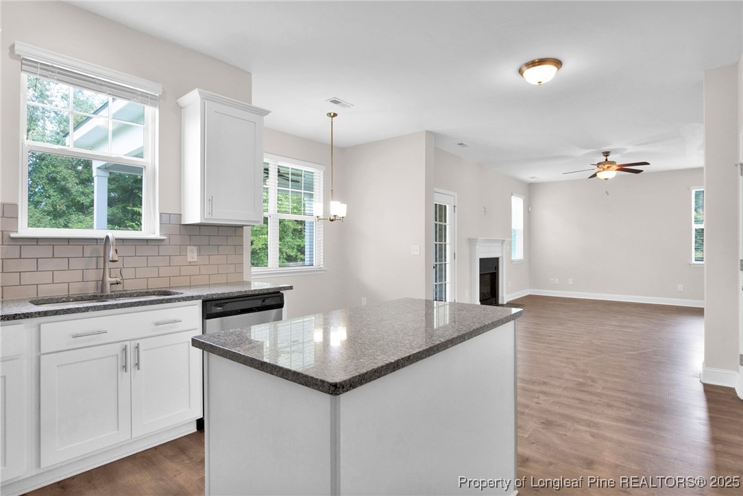 136 Loch Lane Cameron, NC 28326 - Photo 18 of 49 a kitchen with a sink cabinets and window