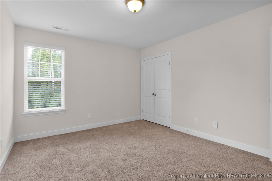 136 Loch Lane Cameron, NC 28326 - Photo 23 of 49 an empty room with a window