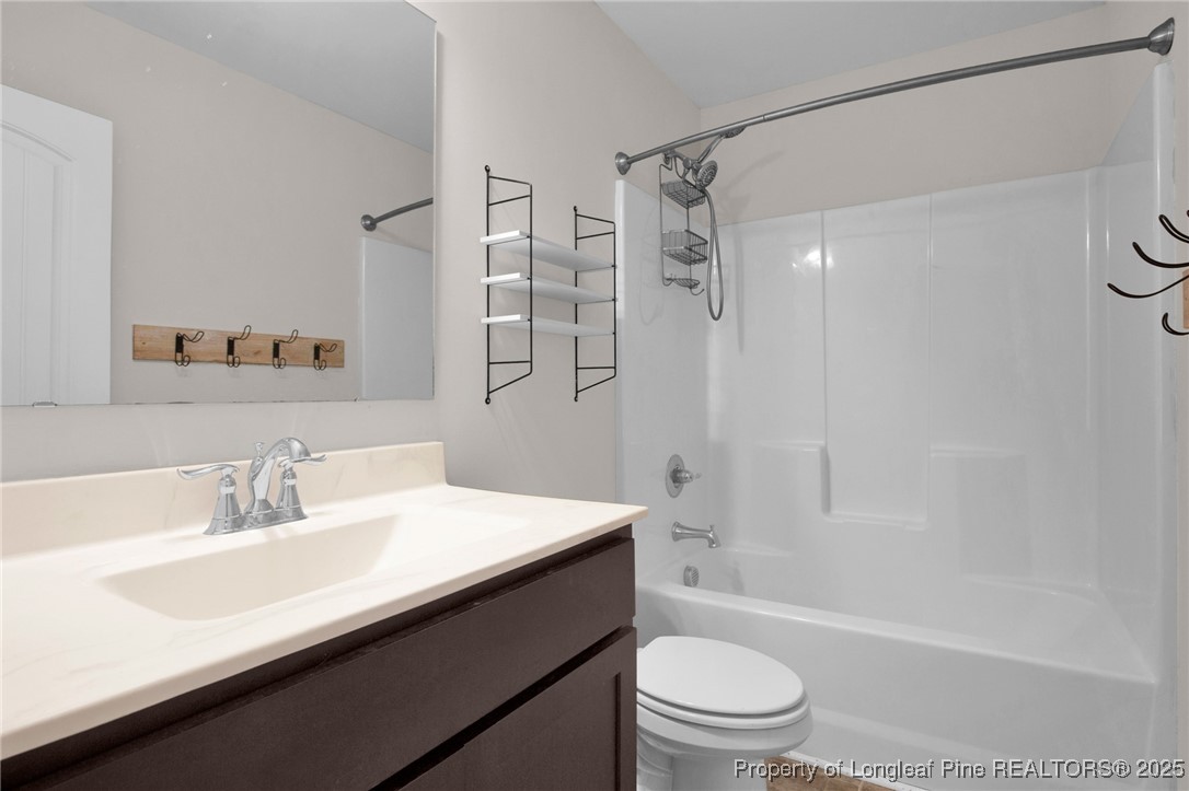 136 Loch Lane Cameron, NC 28326 - Photo 25 of 49 a bathroom with a sink a toilet and shower