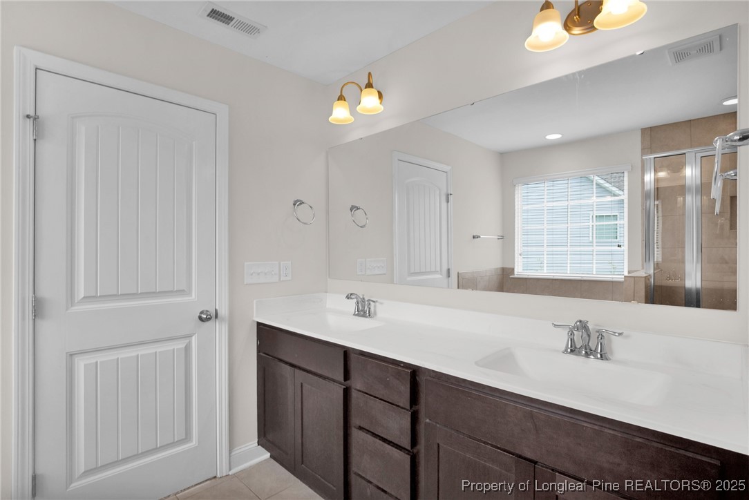 136 Loch Lane Cameron, NC 28326 - Photo 32 of 49 a bathroom with a sink and a mirror