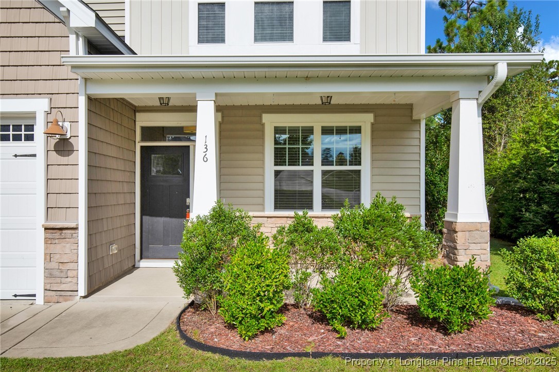 136 Loch Lane Cameron, NC 28326 - Photo 5 of 49 a front view of a house with garden