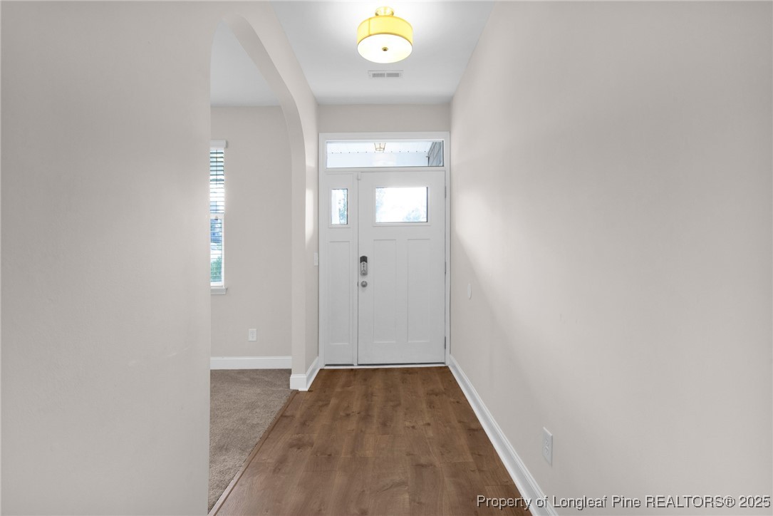 136 Loch Lane Cameron, NC 28326 - Photo 6 of 49 a view of a hallway with wooden floor