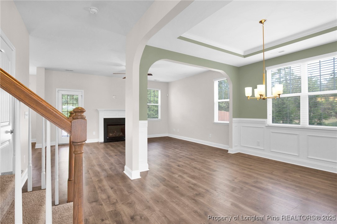 136 Loch Lane Cameron, NC 28326 - Photo 10 of 49 an empty room with wooden floor and windows