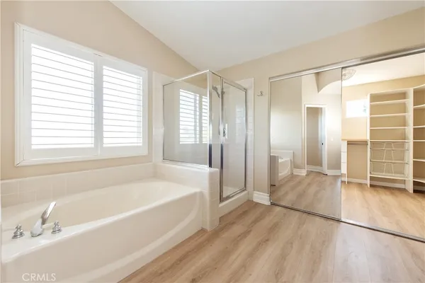 a bathroom with a bathtub and a shower