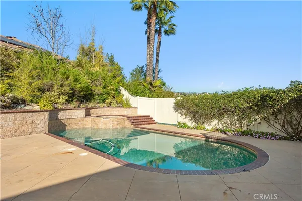 a view of a swimming pool with a patio
