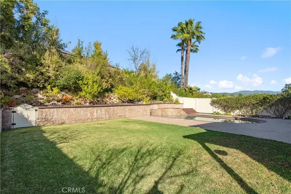 a view of swimming pool with a yard