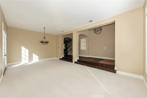 a view of an empty room with a fireplace