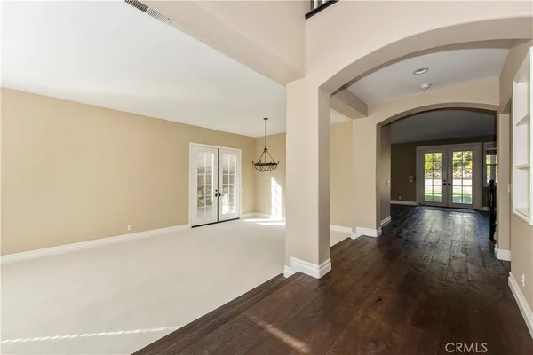 a view of livingroom with hardwood floor and hallway