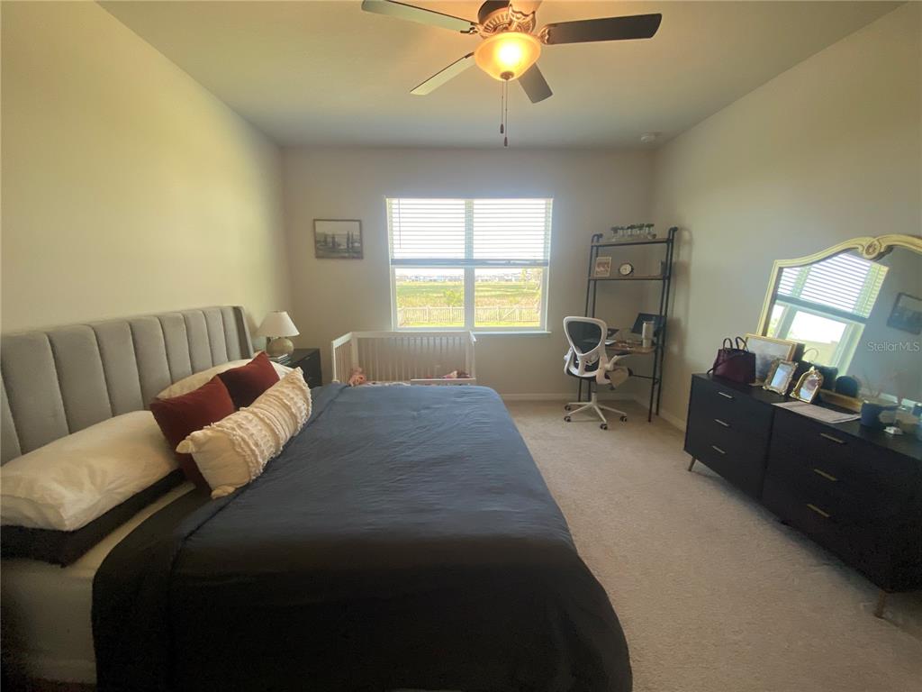 9610 Rally Spring Loop Wesley Chapel, FL 33545 - Photo 17 of 38 a living room with furniture and a large window
