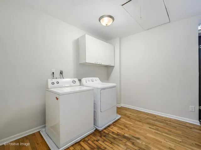 a utility room with a sink dryer and washer