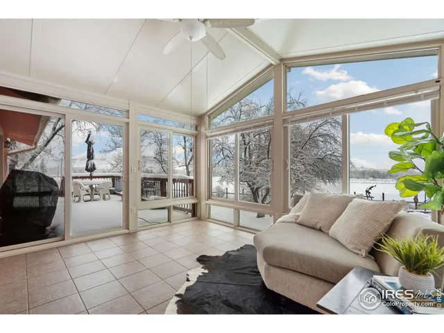 a bedroom with a baby crib and a chair