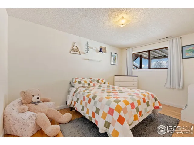 a room with gym equipment and large windows