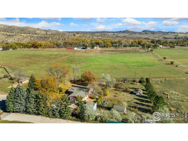 a aerial view of a house with a yard