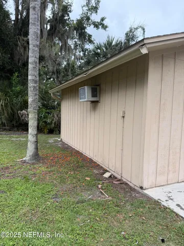 a backyard of a house with lots of green space