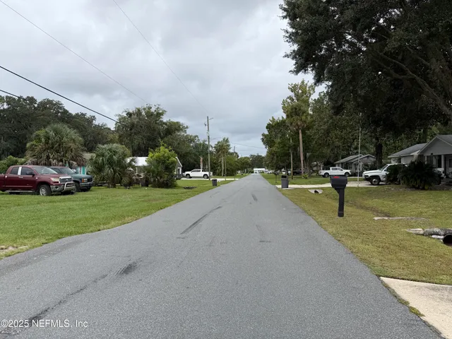 a view of outdoor space with garden and trees