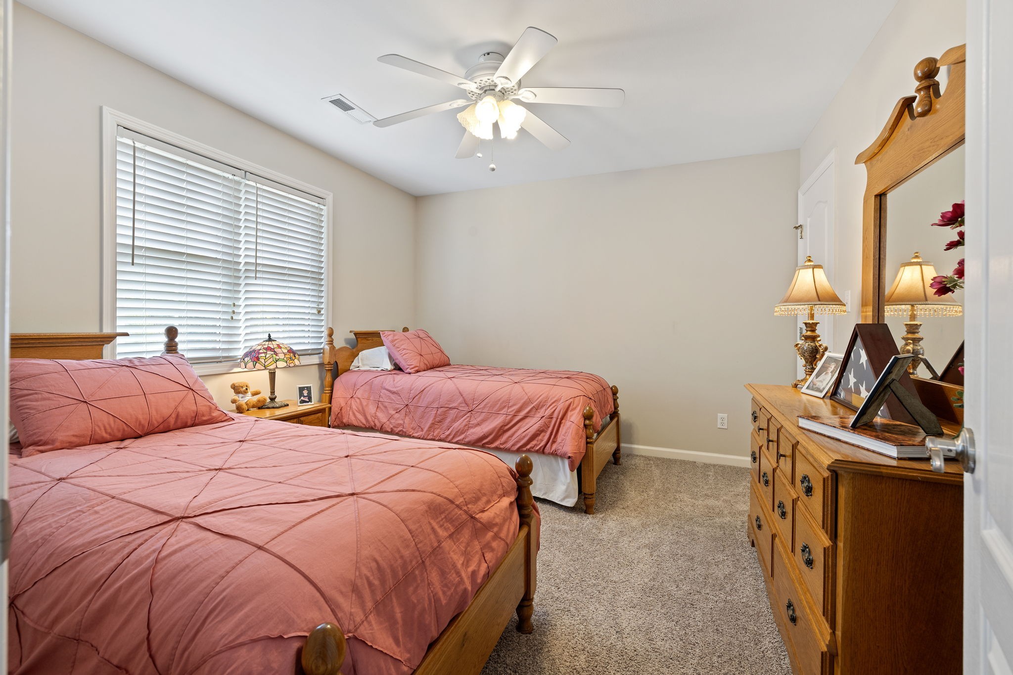 56 Cunningham Hollow Road Fayetteville, TN 37334 - Photo 30 of 54 a bedroom with two beds and a chandelier