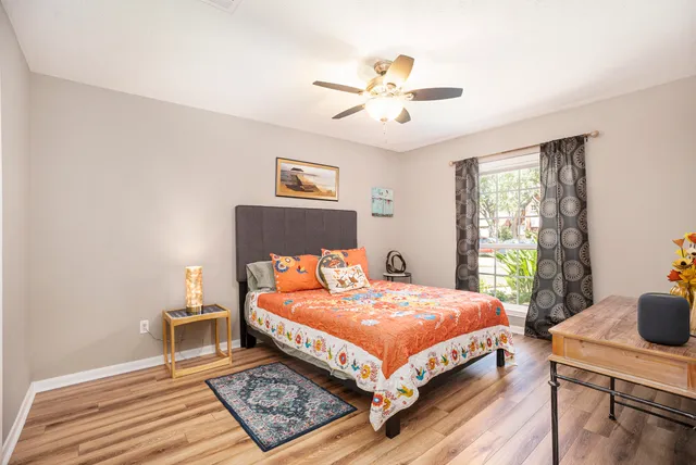 a view of a livingroom with furniture and a flat screen tv