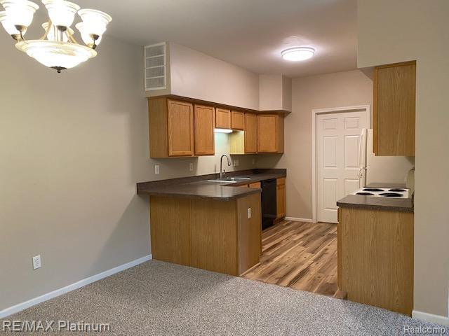 1105 Rial Lake Drive, Unit 45 Howell, MI 48843 - Photo 6 of 19 View from dining area toward kitchen with new vinyl plank flooring.