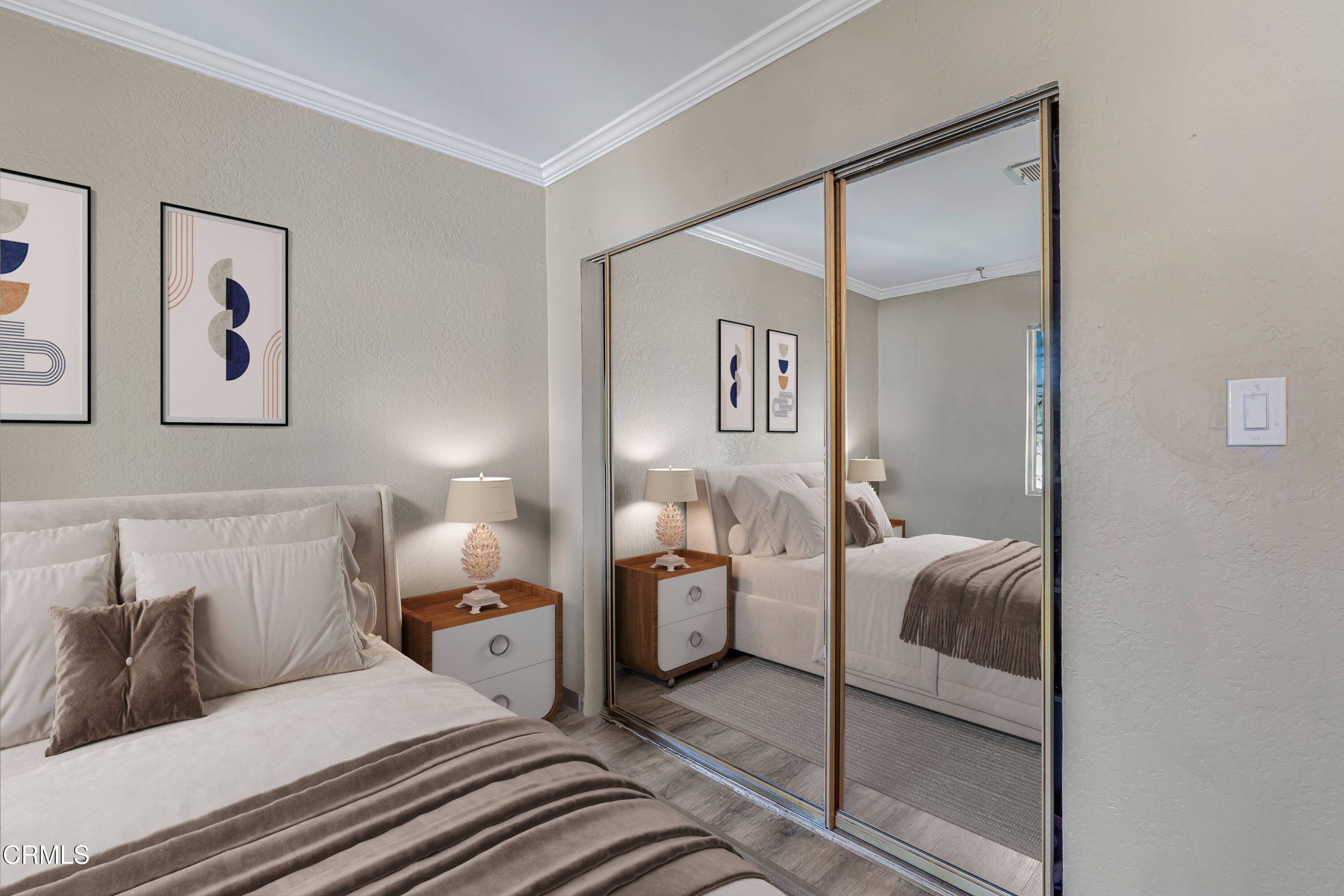 6045 Oak Knolls Road Simi Valley, CA 93063 - Photo 12 of 25 a bedroom with a bed and glass door