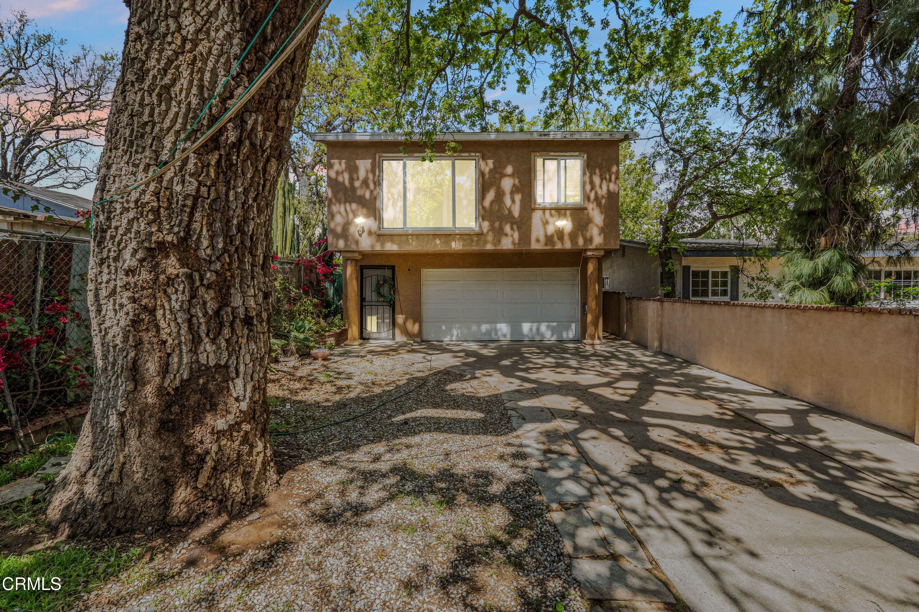 6045 Oak Knolls Road Simi Valley, CA 93063 - Photo 23 of 25 front view of a house with a yard