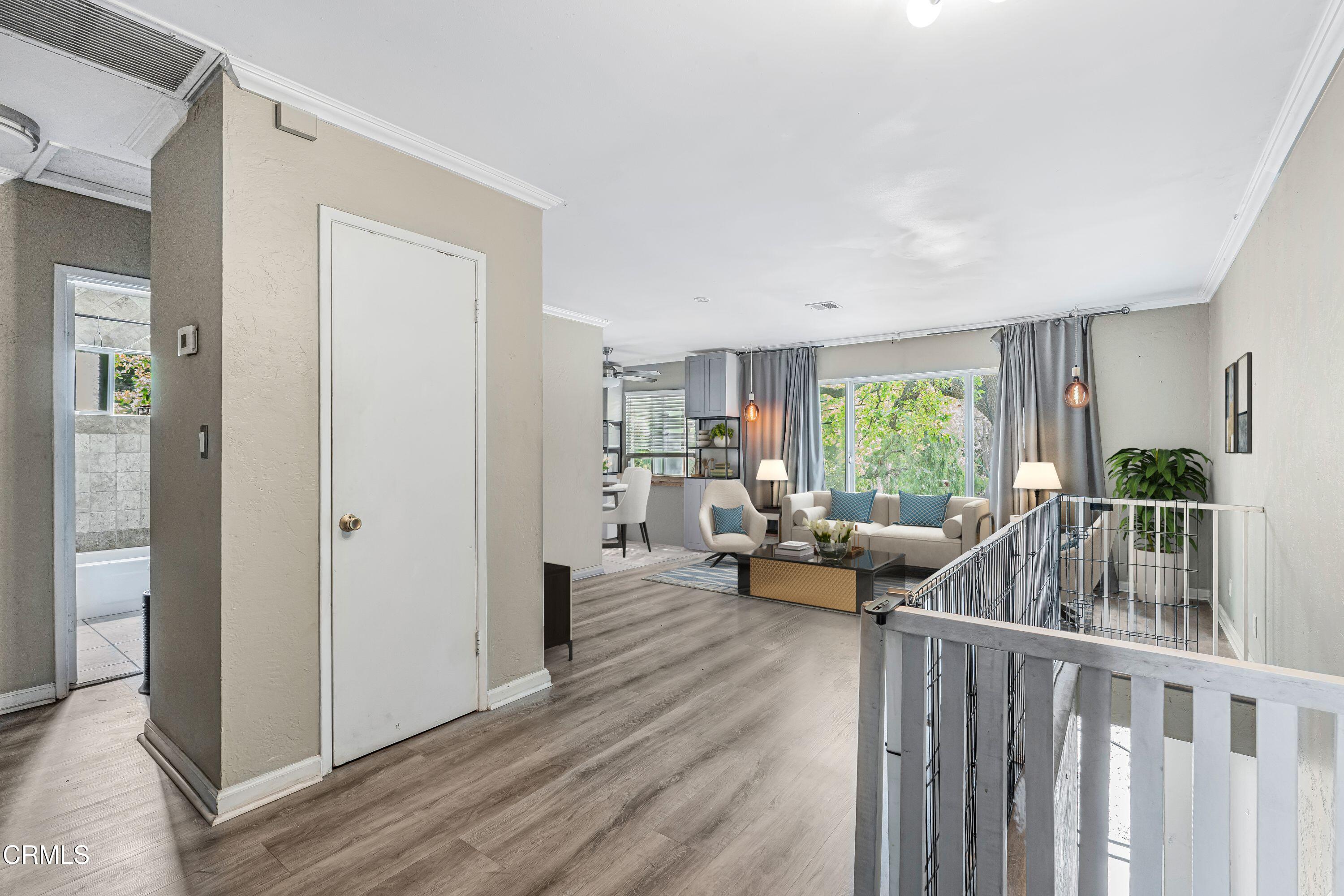6045 Oak Knolls Road Simi Valley, CA 93063 - Photo 4 of 25 a living room with furniture and a large window