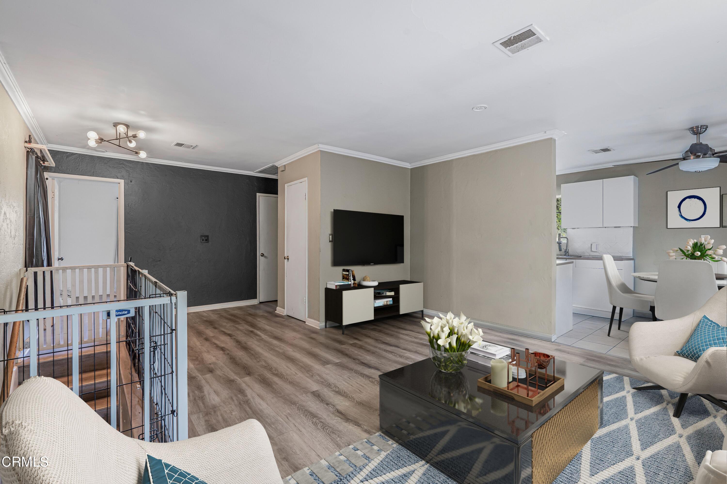 6045 Oak Knolls Road Simi Valley, CA 93063 - Photo 6 of 25 a living room with furniture and a flat screen tv