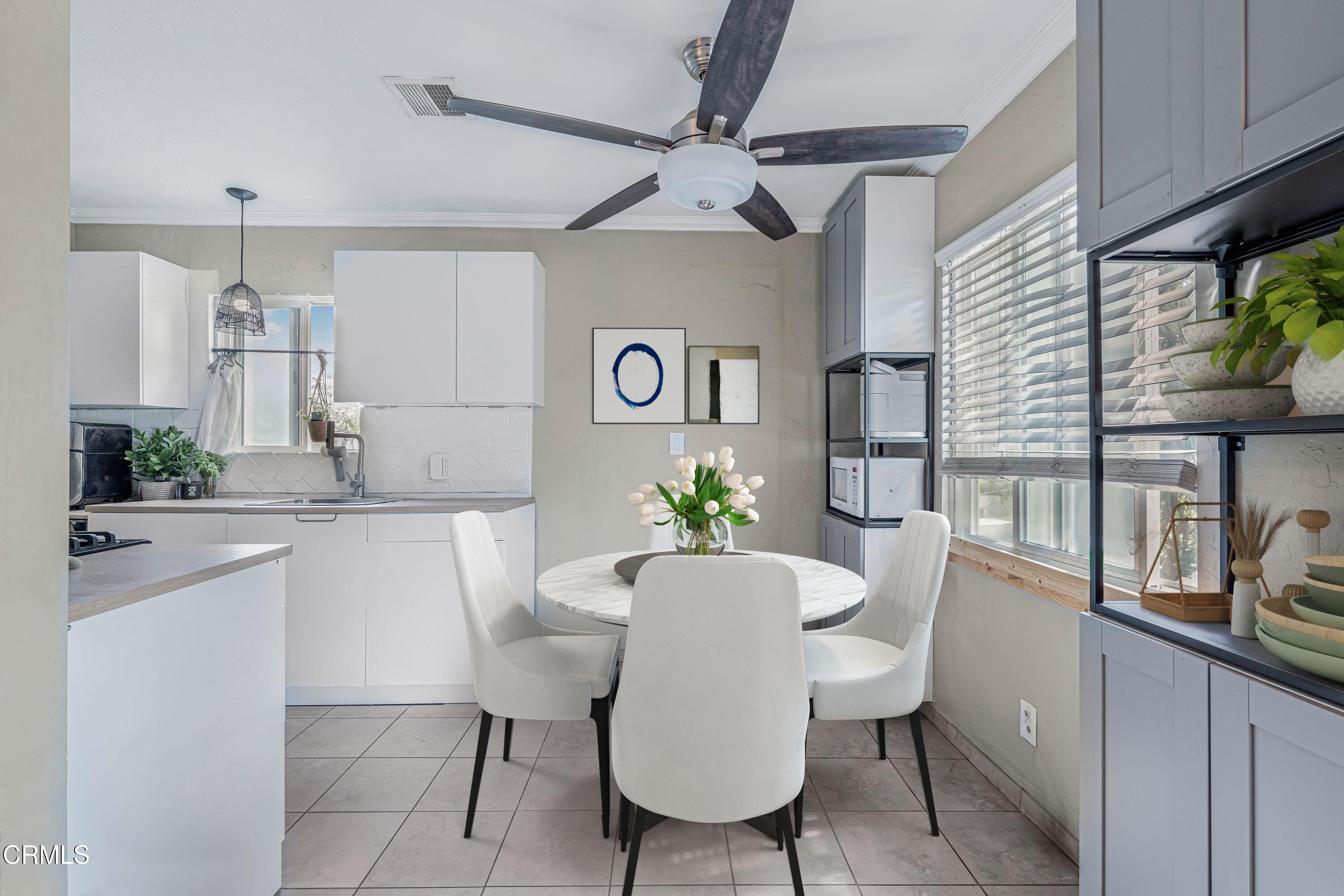 6045 Oak Knolls Road Simi Valley, CA 93063 - Photo 7 of 25 a view of a dining room with furniture window and wooden floor