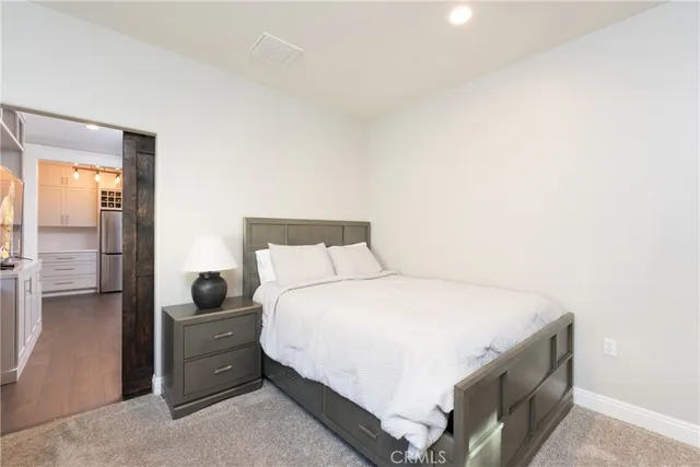 a bedroom with a bed and a view of bathroom