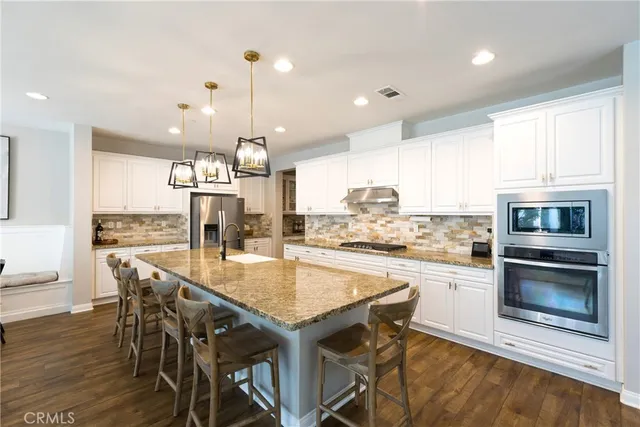 a kitchen with a table and chairs in it