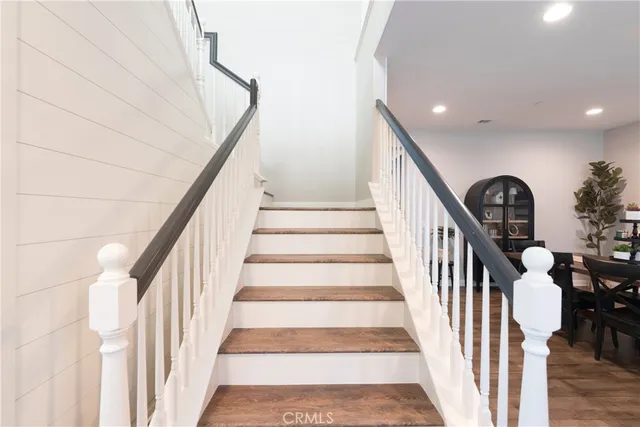a kitchen with a white cabinets and a refrigerator