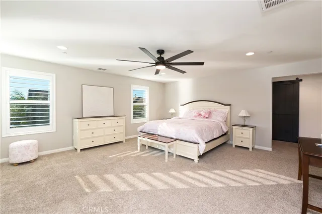 a large white kitchen with a large window