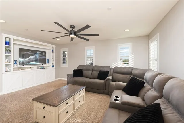 a large white kitchen with a large window