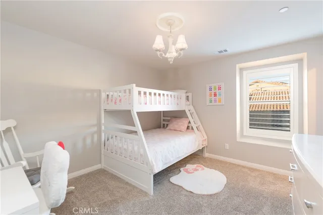 a front view of a house with a yard table and chairs
