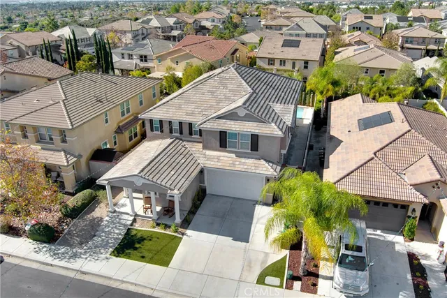 an aerial view of a house with swimming pool