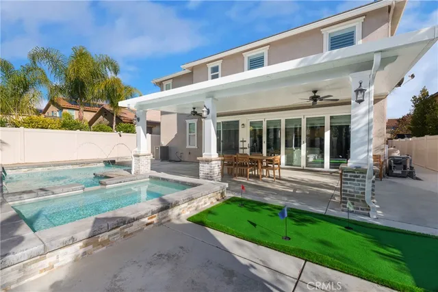 an aerial view of a house with swimming pool
