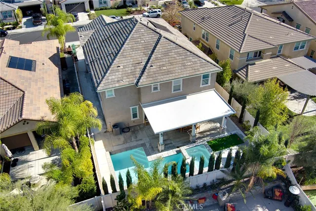 a view of a patio with table and chairs and potted plants