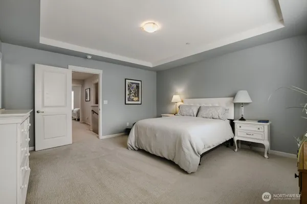 a bedroom with a bed and lamp