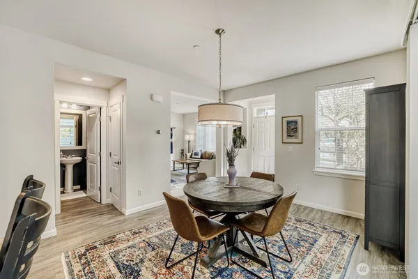 a view of a dining room with furniture window and wooden floor