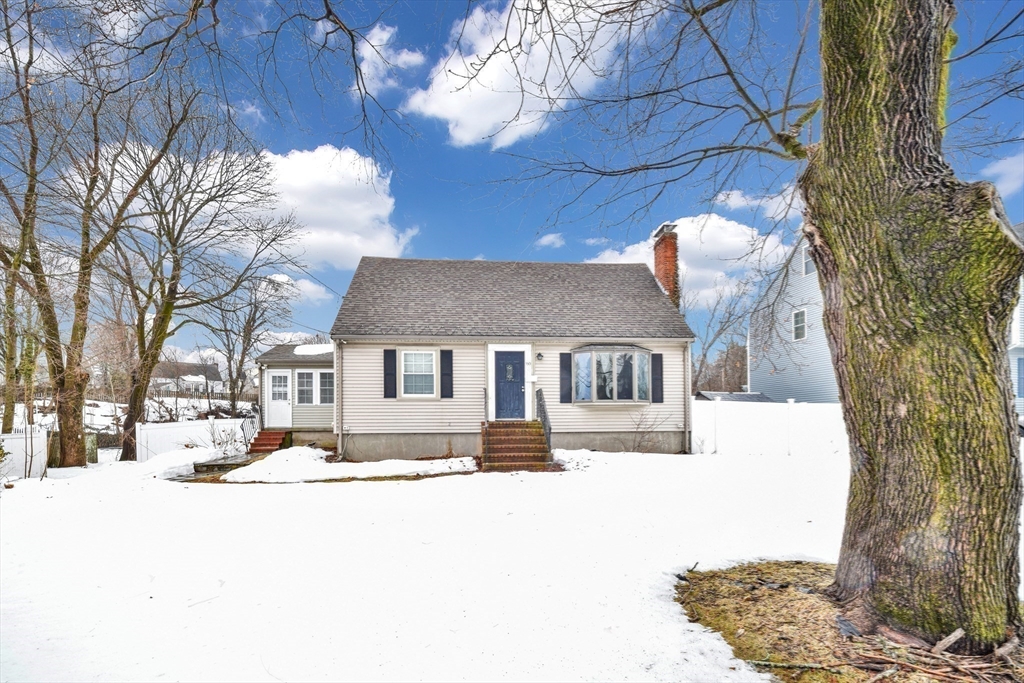 153 Colburn Street Dedham, MA 02026 - Photo 1 of 40 a view of a house with snow on the road