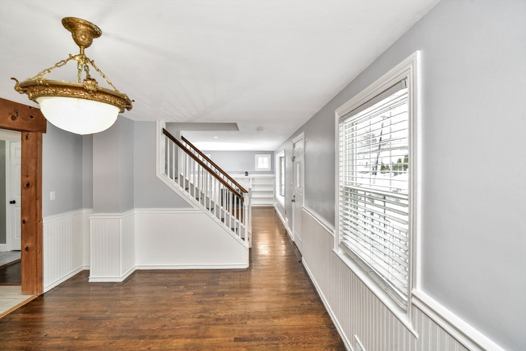 153 Colburn Street Dedham, MA 02026 - Photo 16 of 40 a view of entryway and hall with wooden floor