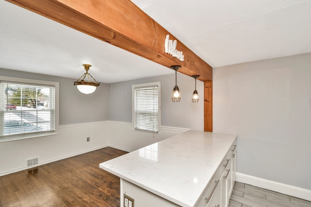 153 Colburn Street Dedham, MA 02026 - Photo 18 of 40 a view of a kitchen with a sink and cabinet