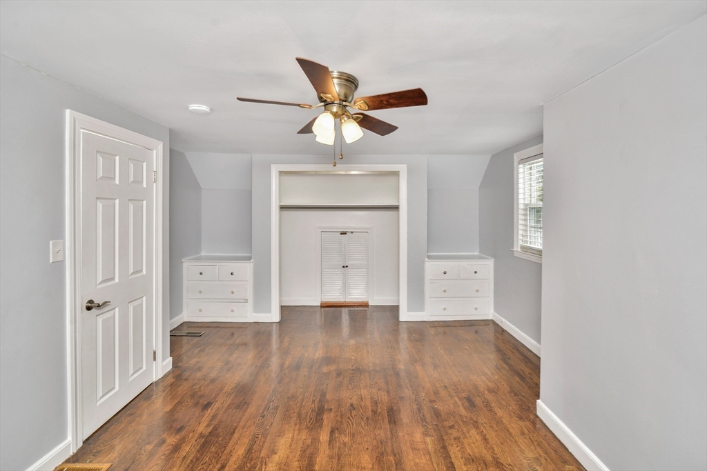153 Colburn Street Dedham, MA 02026 - Photo 19 of 40 a view of an empty room and wooden floor