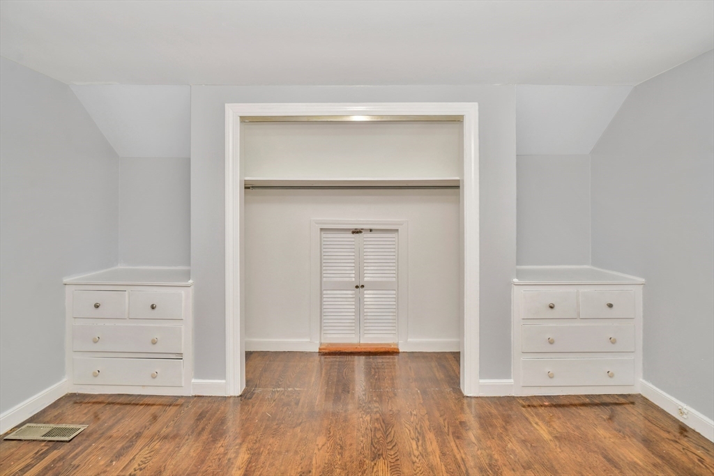 153 Colburn Street Dedham, MA 02026 - Photo 20 of 40 wooden floor in white cabinet