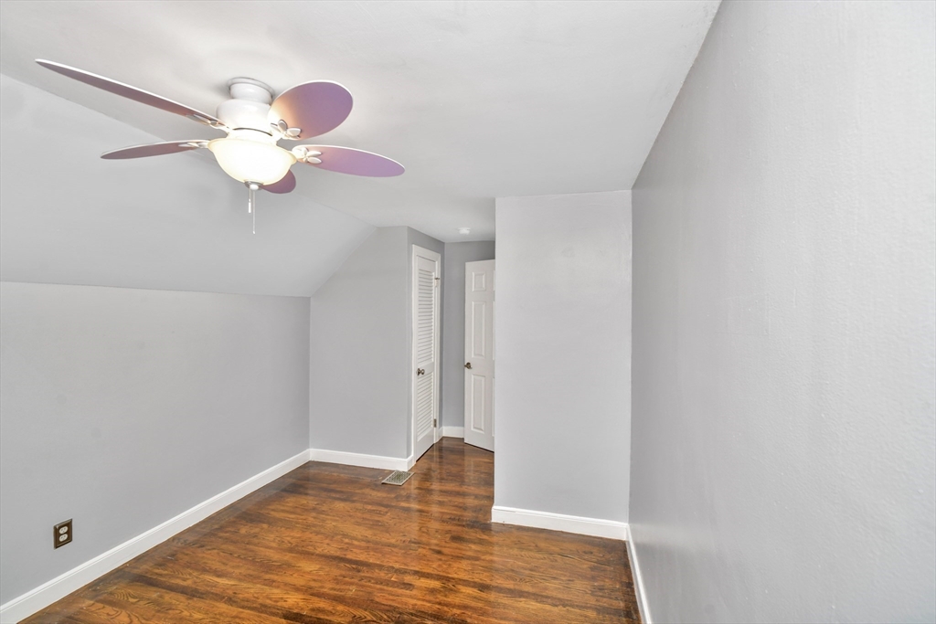 153 Colburn Street Dedham, MA 02026 - Photo 24 of 40 a view of an empty room with a window