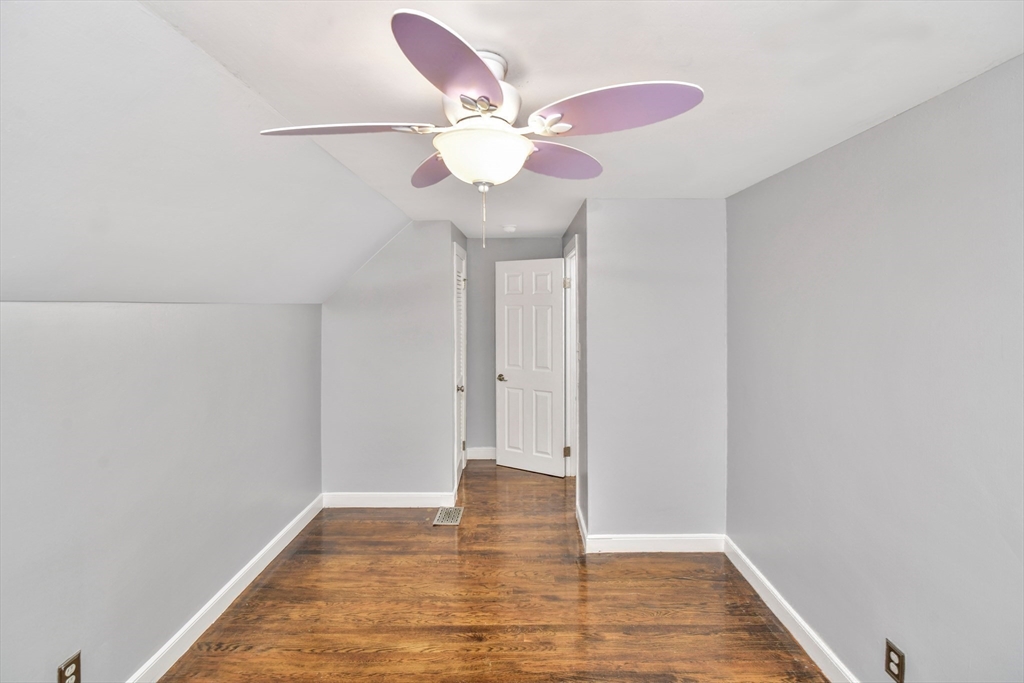 153 Colburn Street Dedham, MA 02026 - Photo 25 of 40 a view of an empty room with wooden floor